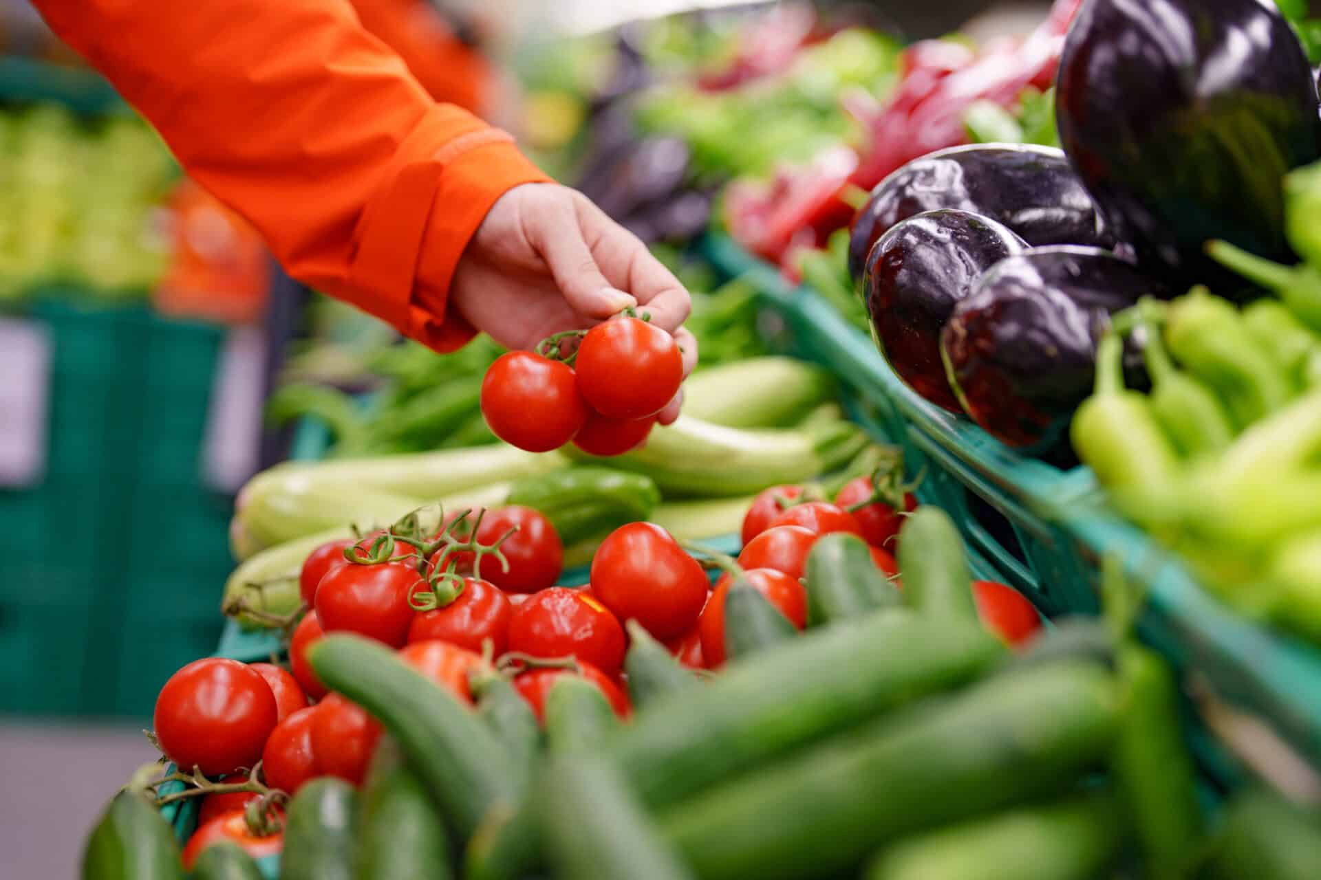 Man shopping vegetables in groceries store