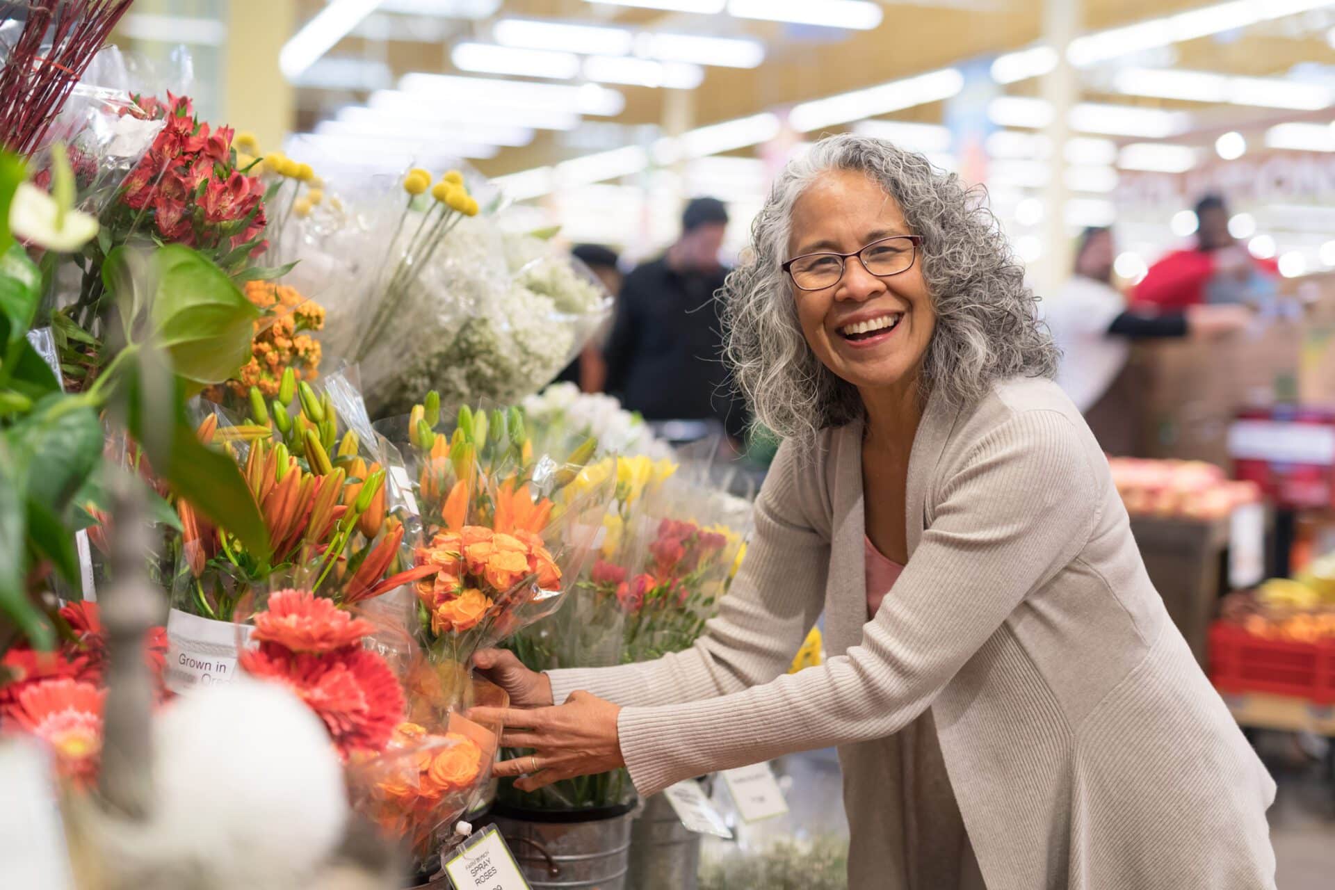 Woman picks out flowers at the store